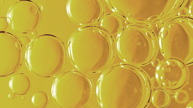 Bubbles in yellow oil