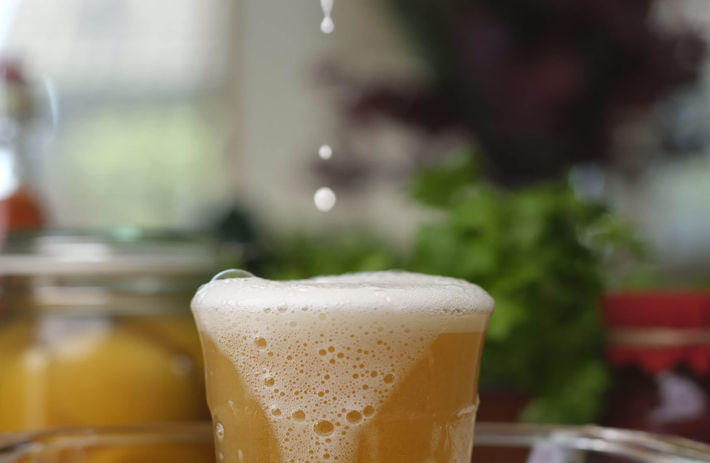 Beer being poured into glass which is overflowing 11