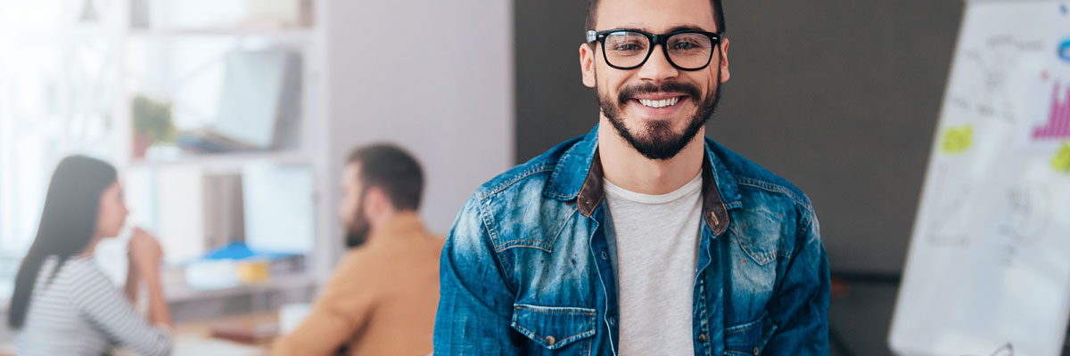 Smiling beardy guy in an office