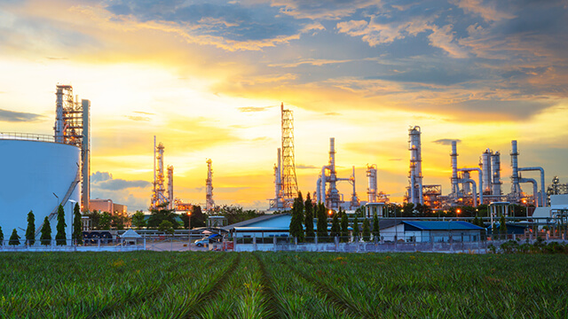 oil-refinery-sunset-green-plants