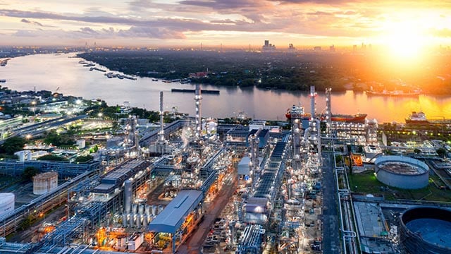 industrial-plant-by-river-in-sunset.jpg