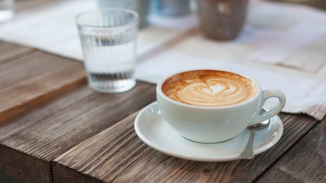 Cup-of-coffee-and-glass-of-water-on-a-table