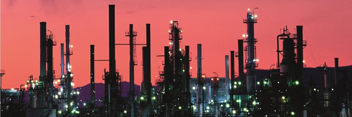 Petrochemical plant in front of a red sky