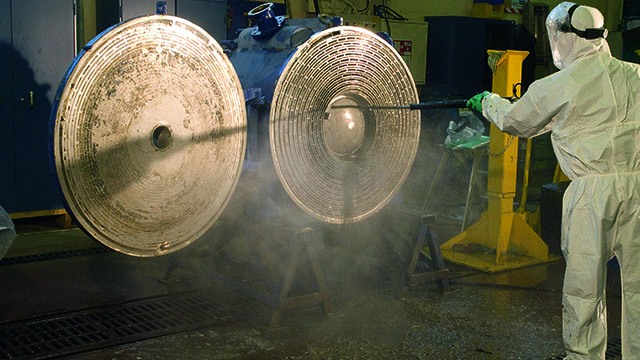 Man cleaning Alfa Laval welded spiral heat exchangers