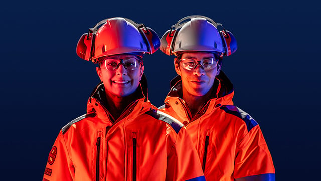 Male and femle engineers wearing hard hat and safety glasses