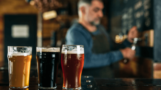 three-craft-beers-bar-bartender-pouring-tap.png