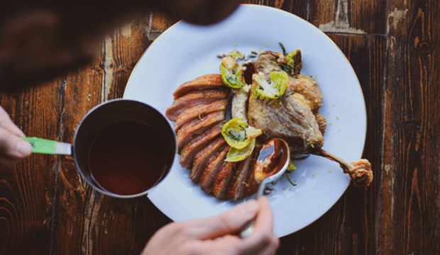 gourmet-duck-breast-confit-leg-brussels-sprouts-brown-sauce.png